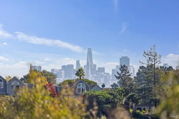 a view of a city with tall buildings
