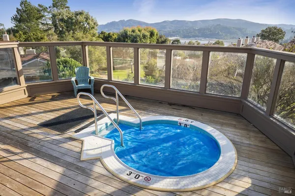 a view of a swimming pool with a lake view