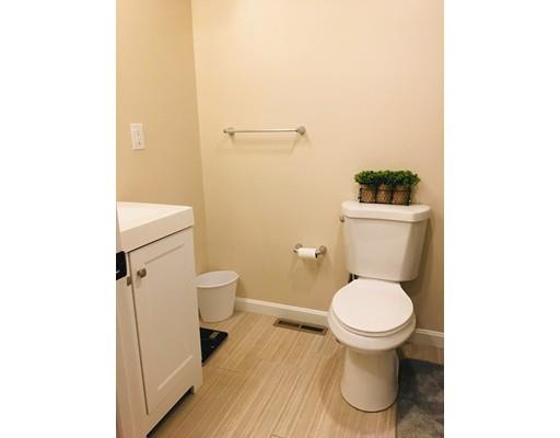 68 Breakneck Road Sturbridge, MA 01566 - Photo 11 of 13 a white toilet sitting next to a bathroom sink