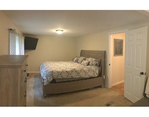 68 Breakneck Road Sturbridge, MA 01566 - Photo 6 of 13 a bedroom with a bed and a view of bathroom