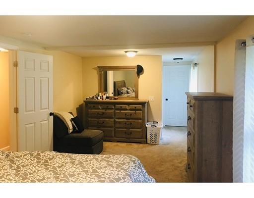 68 Breakneck Road Sturbridge, MA 01566 - Photo 7 of 13 a living room with furniture and a flat screen tv