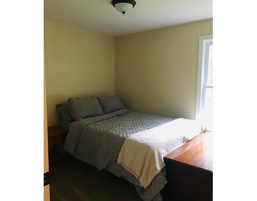 68 Breakneck Road Sturbridge, MA 01566 - Photo 9 of 13 a bedroom with a bed and a cabinets