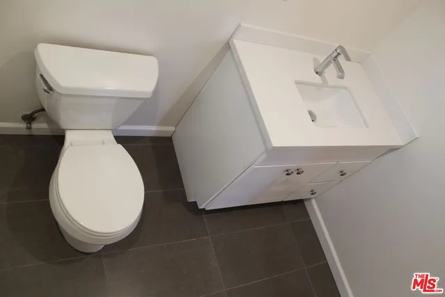 a bathroom with a toilet and a sink
