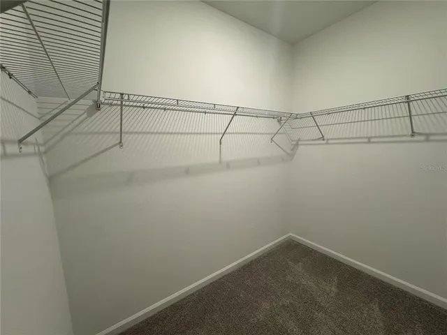 a bathroom with a double vanity sink and mirror