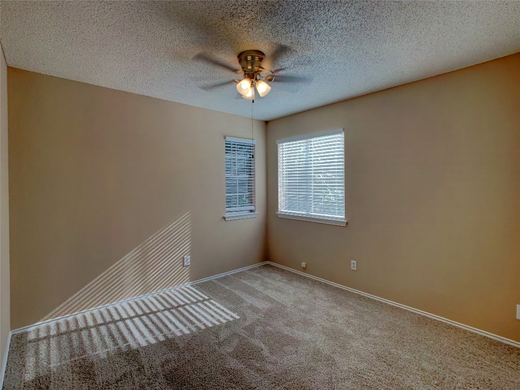 12705 Modena Trail Austin, TX 78729 - Photo 15 of 16 a view of an empty room with a window