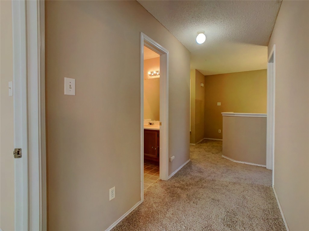 12705 Modena Trail Austin, TX 78729 - Photo 10 of 16 an empty room with closet and mirror