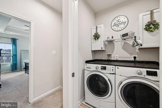 an empty room with ceiling fan and window