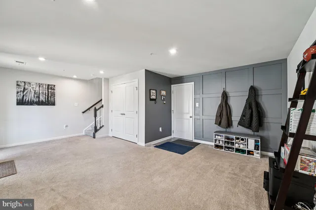 a view of a big room with windows and cabinet