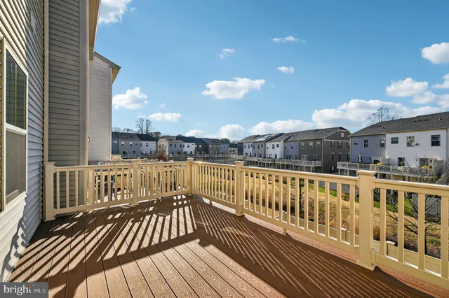 a balcony with table and chairs