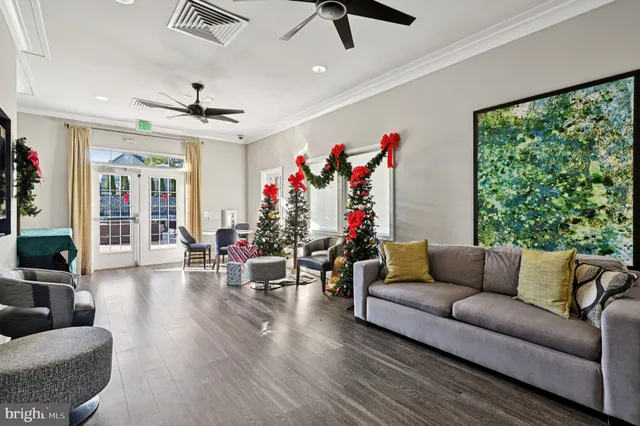 a gym room with lots of gym equipment and a large window