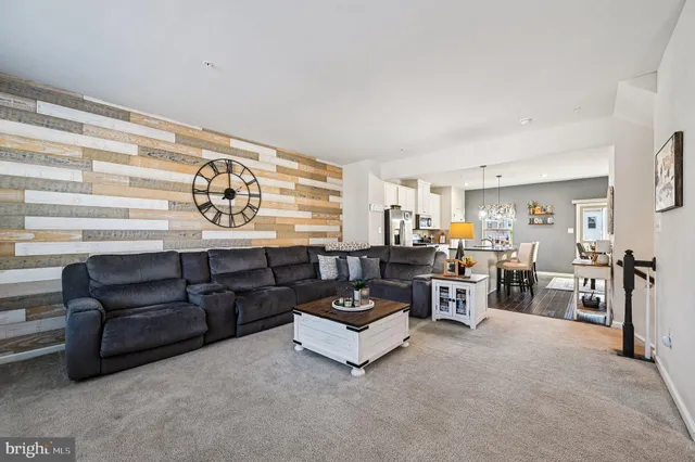 a living room with furniture and white walls