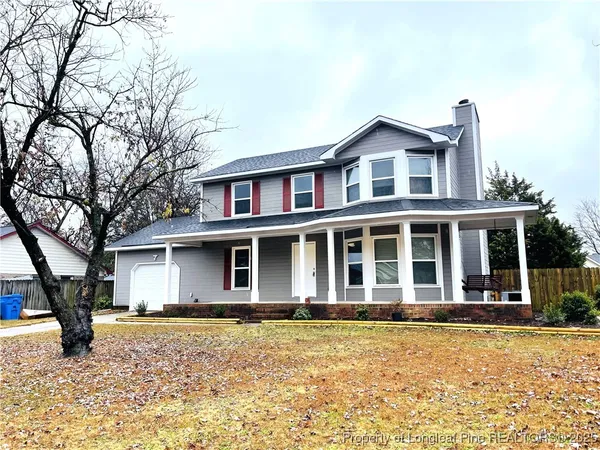 a house with trees in front of it