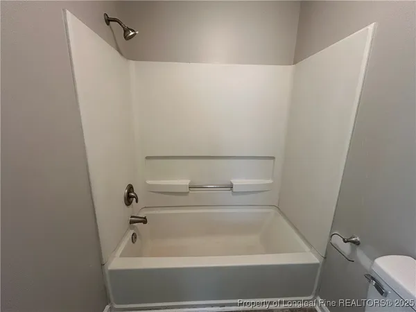 a bathroom with a white bath tub