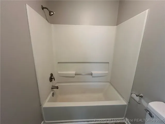 a bathroom with a white bath tub