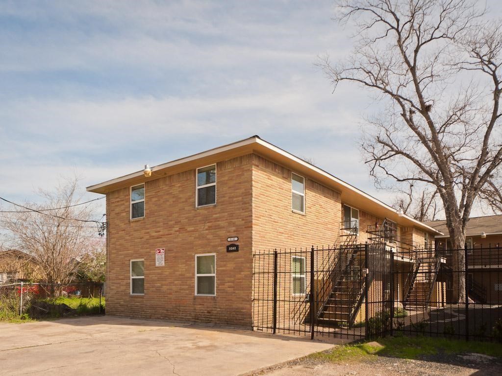 3202 Yale Street, Unit 6 Houston, TX 77018 - Photo 2 of 18 a view of a house with a yard