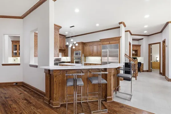 a kitchen with a table and chairs in it