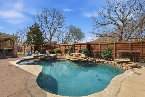 a view of a swimming pool with a patio