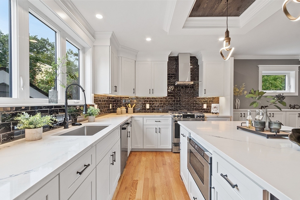 a kitchen with cabinets a sink and appliances