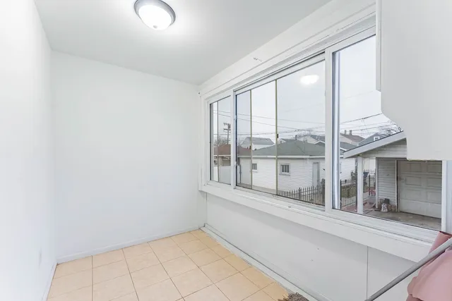 a view of staircase with white walls and a window