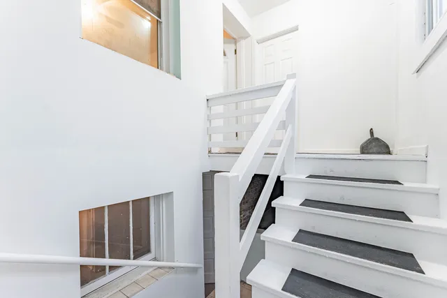 an empty room with entrance and door