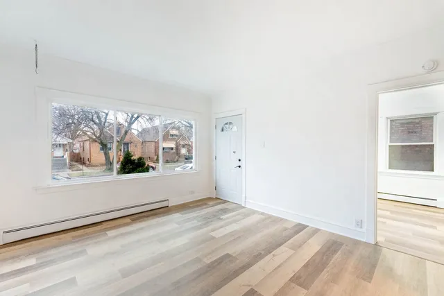 an empty room with large window