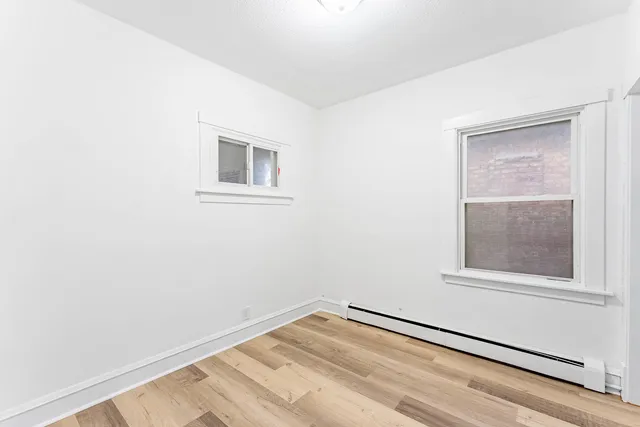 a view of a room that has a window in it