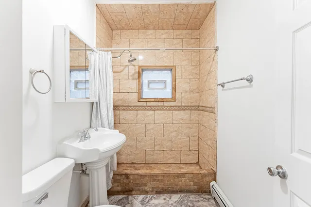 a bathroom with a sink and shower