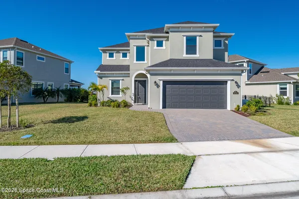 front view of a house with a yard