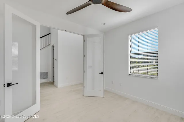 a view of an empty room with a window