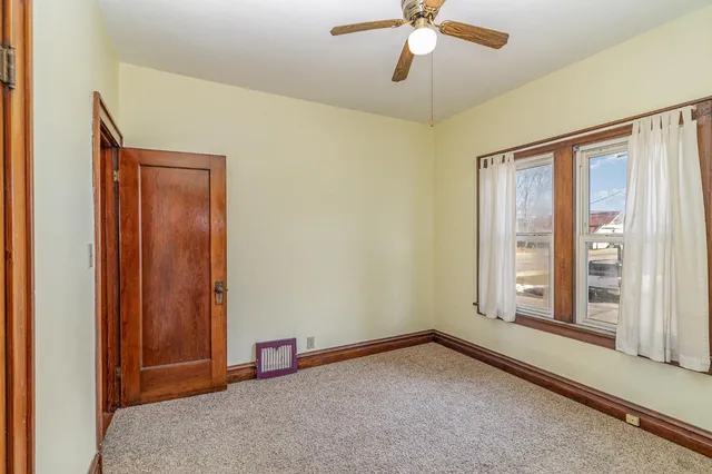 a view of a yard with snow on the road