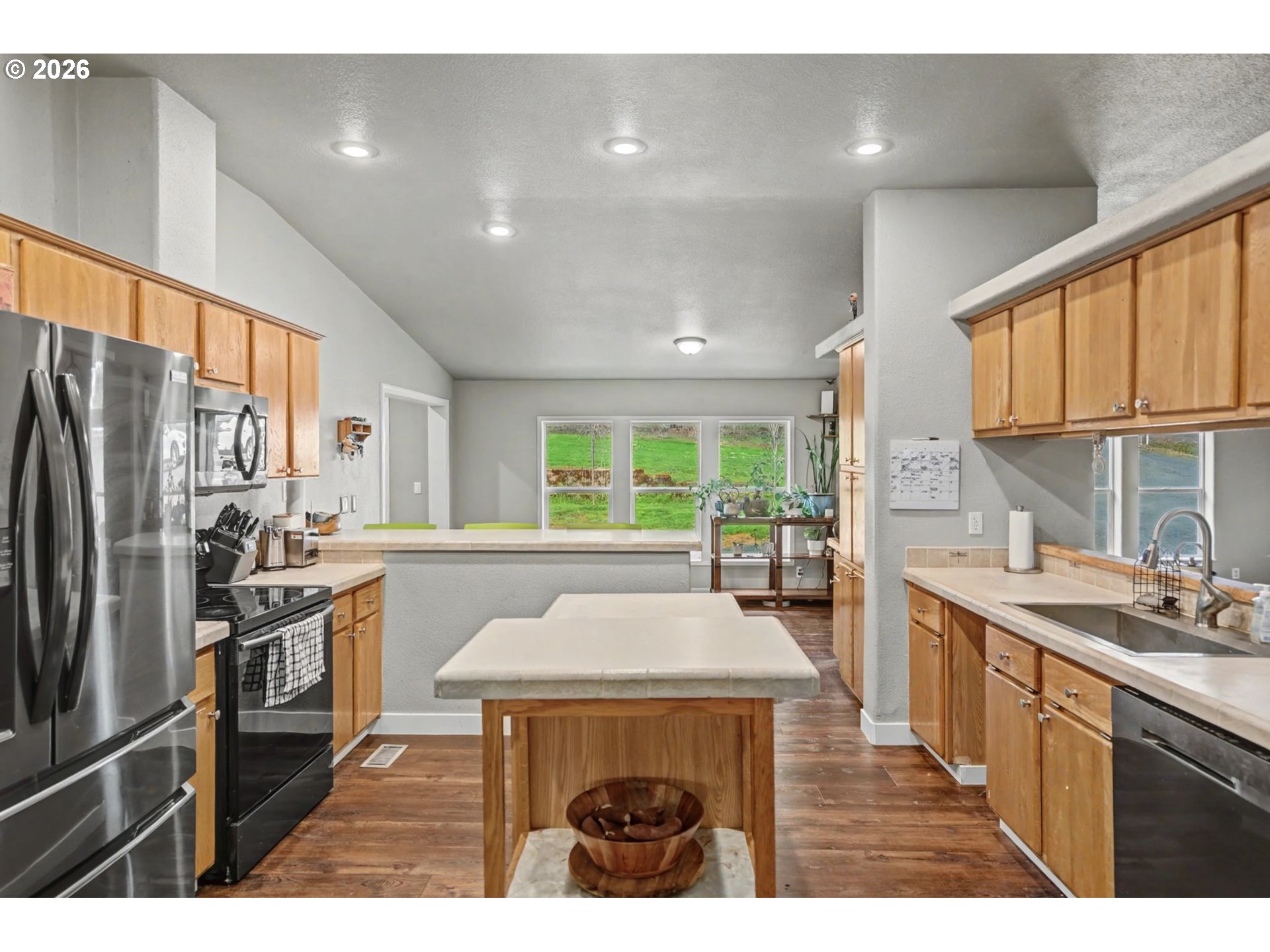 16310 Oakdale Road Dallas, OR 97338 - Photo 16 of 45 a kitchen with stainless steel appliances a sink stove and refrigerator