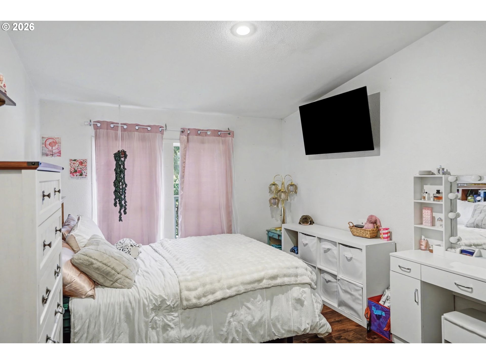 16310 Oakdale Road Dallas, OR 97338 - Photo 21 of 45 a bedroom with a bed and a flat screen tv