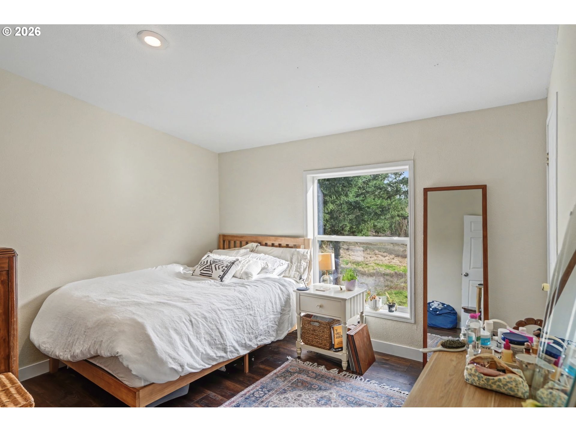 16310 Oakdale Road Dallas, OR 97338 - Photo 23 of 45 a bedroom with a bed and wooden floor