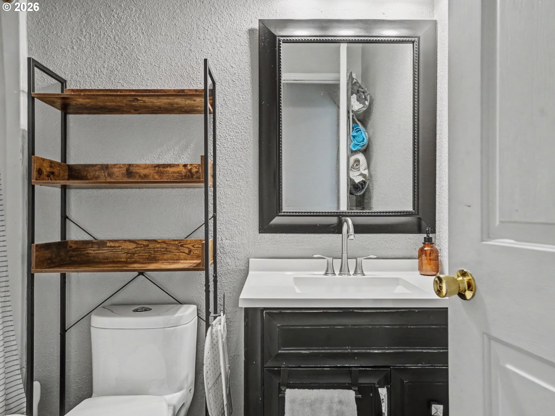 16310 Oakdale Road Dallas, OR 97338 - Photo 24 of 45 a bathroom with a sink and a mirror