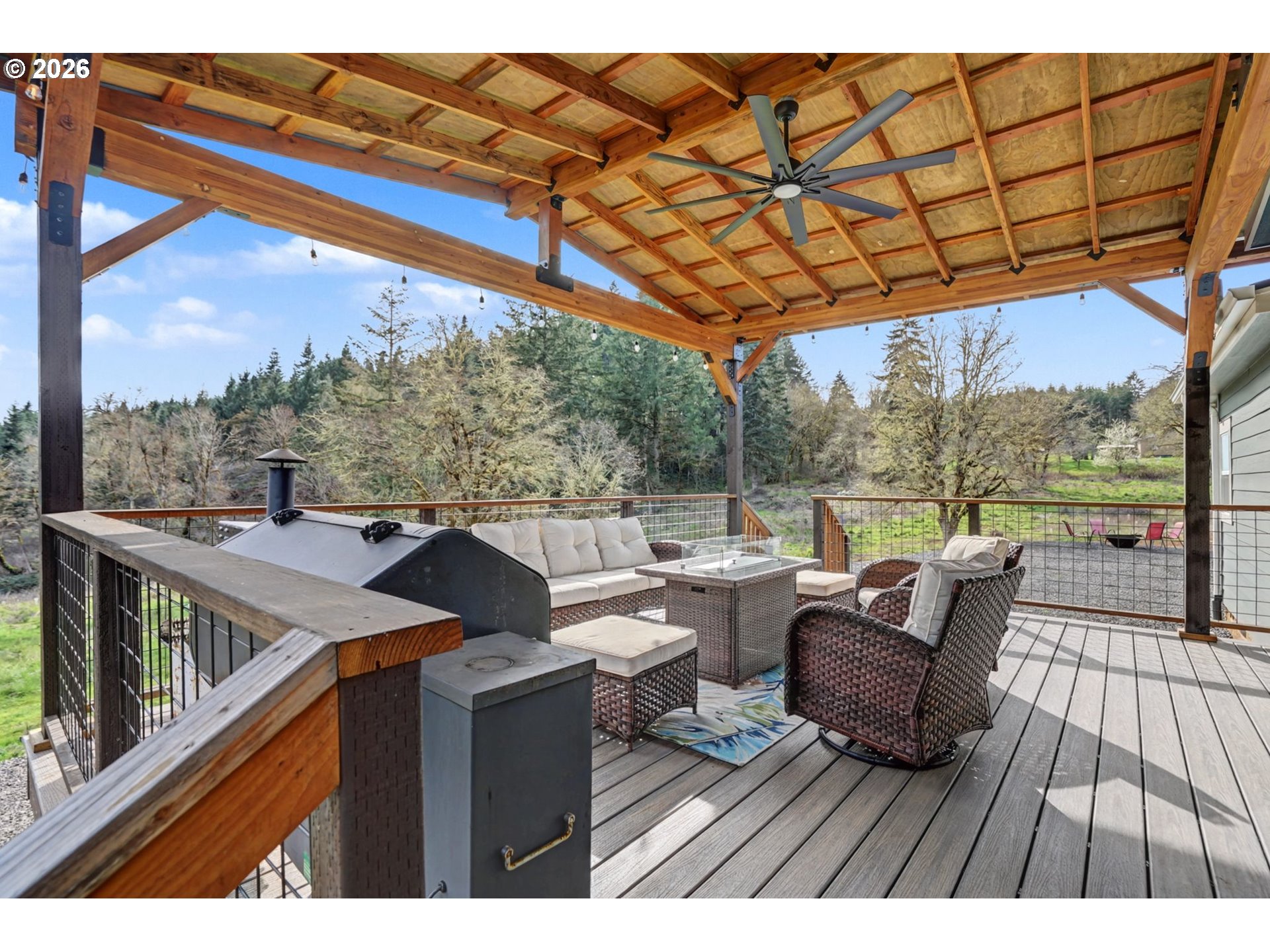 16310 Oakdale Road Dallas, OR 97338 - Photo 27 of 45 a view of a patio with couches chairs dining table and chairs