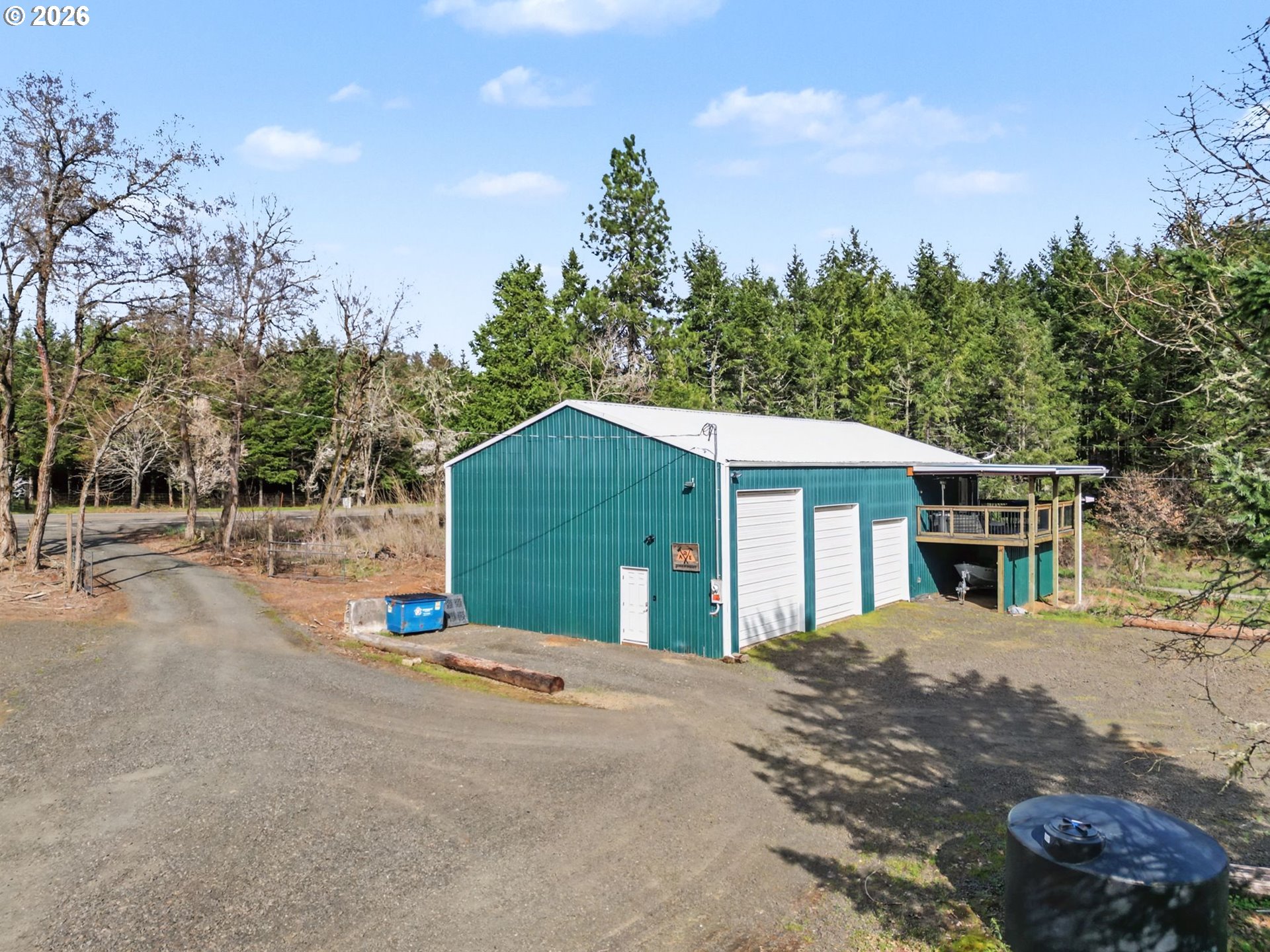 16310 Oakdale Road Dallas, OR 97338 - Photo 30 of 45 a front view of a house with a yard and trees