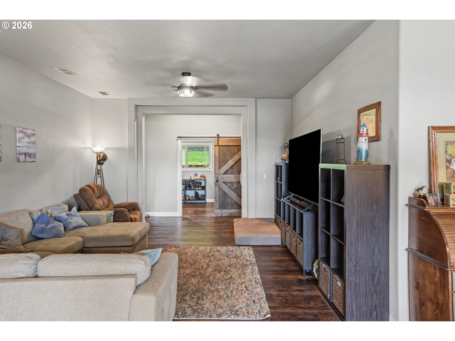 16310 Oakdale Road Dallas, OR 97338 - Photo 5 of 45 a living room with furniture and a flat screen tv