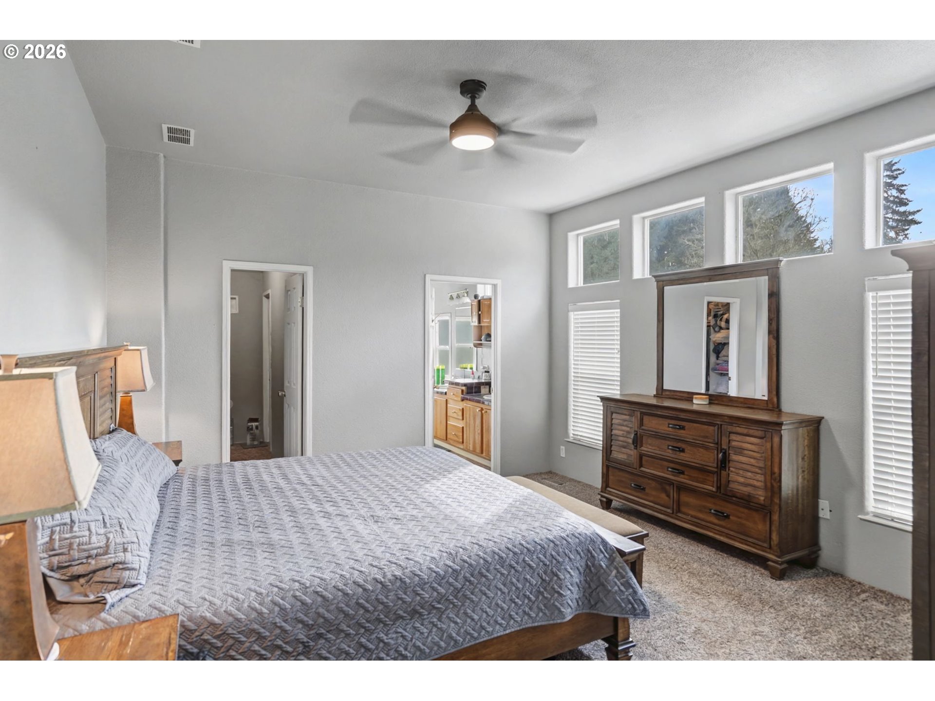 16310 Oakdale Road Dallas, OR 97338 - Photo 9 of 45 a bedroom with a bed and wooden floor