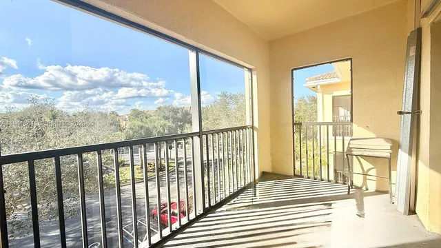 a view of a porch with wooden floor