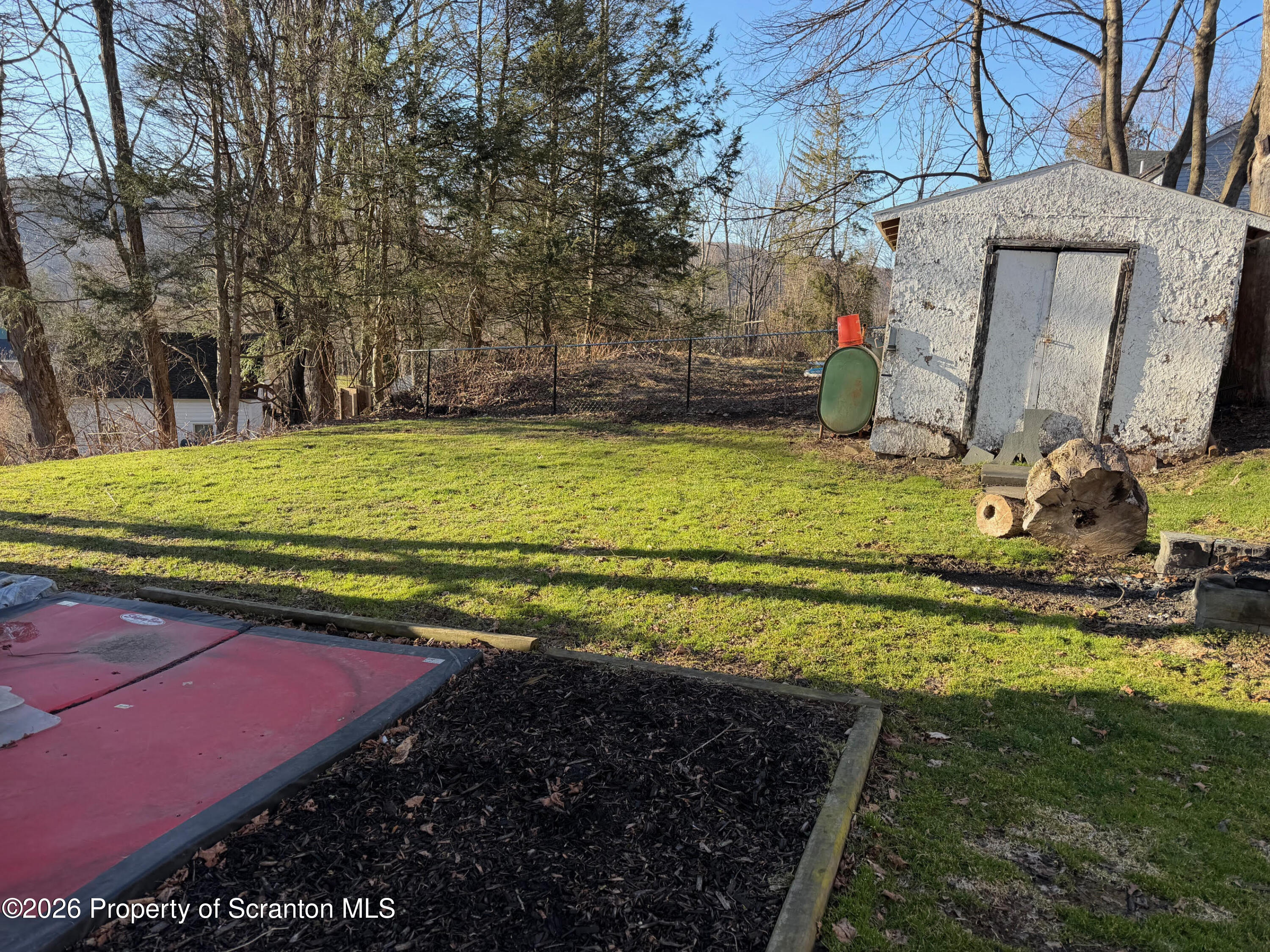29 Maple Street Susquehanna, PA 18847 - Photo 2 of 9 a view of a backyard with basketball court