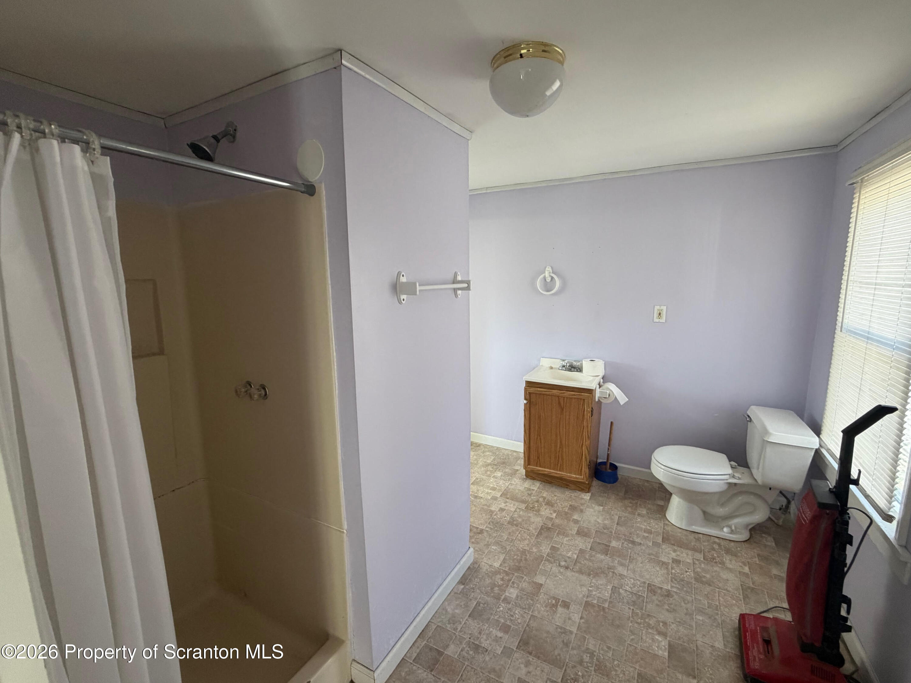 29 Maple Street Susquehanna, PA 18847 - Photo 6 of 9 a bathroom with a toilet and a shower