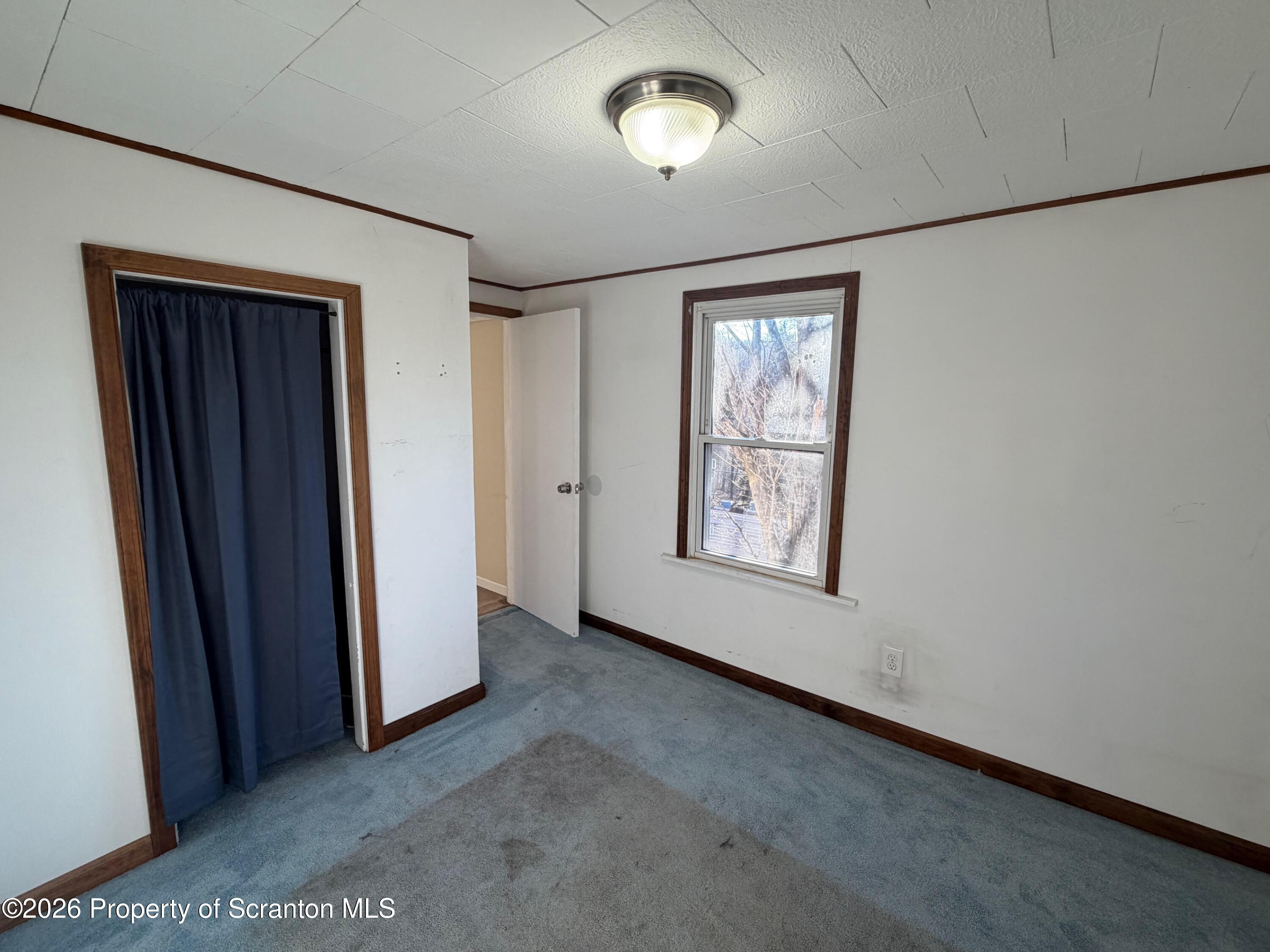 29 Maple Street Susquehanna, PA 18847 - Photo 8 of 9 an empty room with windows and closet