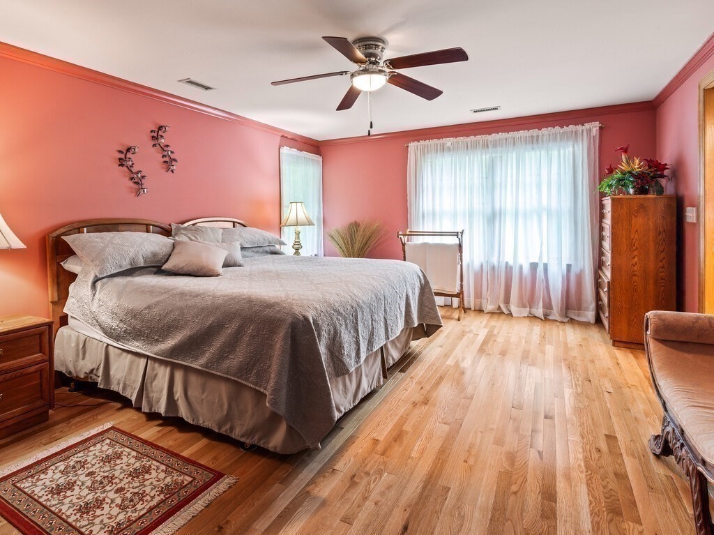 9 Santom Street Auburn, MA 01501 - Photo 17 of 42 a spacious bedroom with a bed and wooden floor
