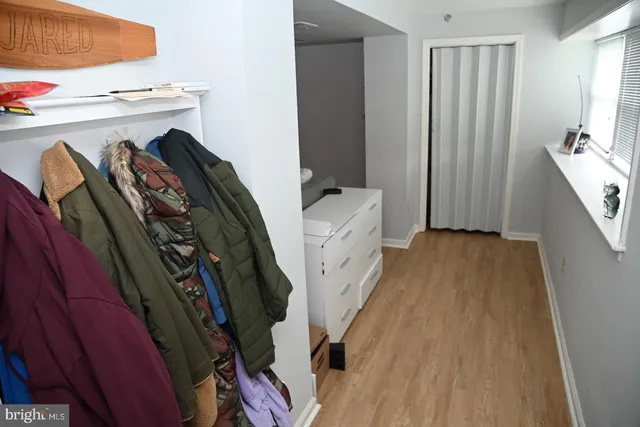 a bedroom with a bed and a mirror