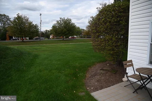 a bedroom with a bed and a table