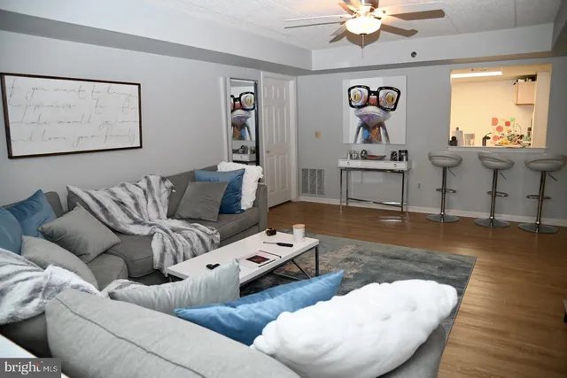 a kitchen with a refrigerator sink stove and cabinets