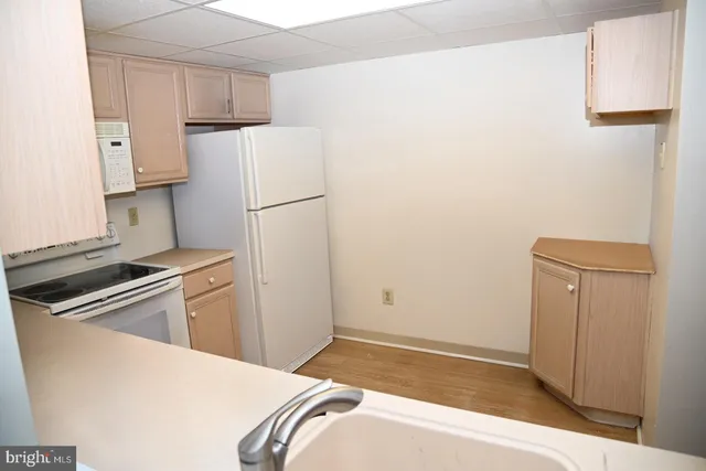 a dining room with furniture and a window
