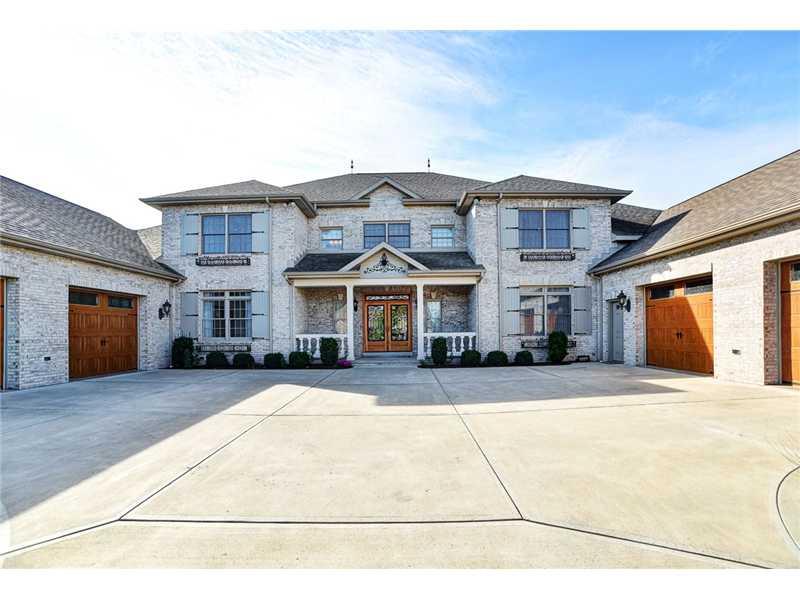 1114 Winnie Way Latrobe, PA 15650 - Photo 2 of 25 Exterior Front. Closer view of the front of the home shows all the exceptional craftsmanship the home has with custom garage doors and the beautiful leaded front door.