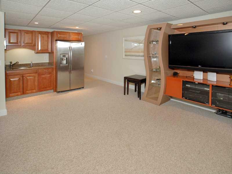 1114 Winnie Way Latrobe, PA 15650 - Photo 19 of 25 Basement/Game Room. Lower level family room with a sink and refrigerator. This area also has an exercise room and many extra amenities