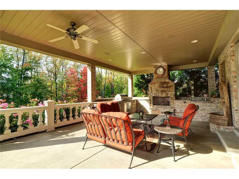 1114 Winnie Way Latrobe, PA 15650 - Photo 22 of 25 Patio/Deck. View of the rear terrace with its exceptional workmanship. Includes gas fireplace, built-in grill and sink.